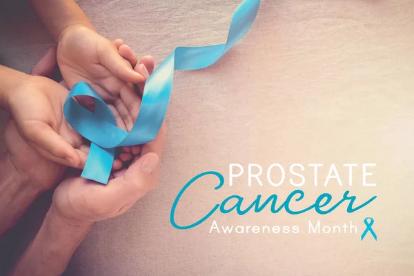 Adult Child Hands Holding Light Blue Ribbon Prostate Cancer Awareness — Stock Photo, Image