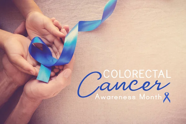 Adult Child Hands Holding Blue Ribbon Colorectal Cancer Awareness Month — Stock Photo, Image