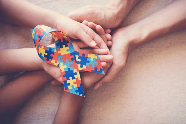 Hands Holding Puzzle Ribbon Autism Awareness — Stock Photo, Image
