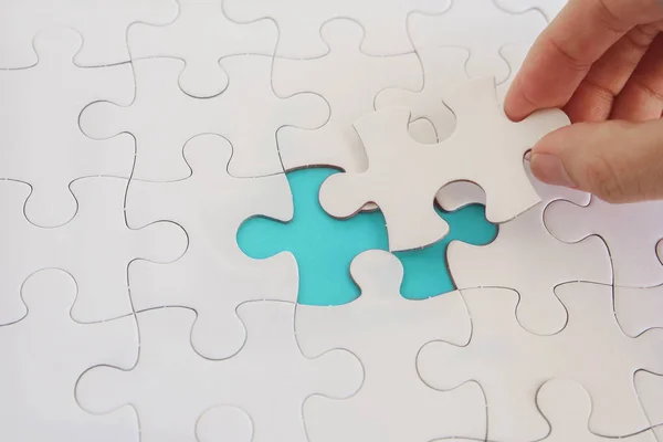 Hands with jigsaw puzzle pieces, Business strategy planning, Alz