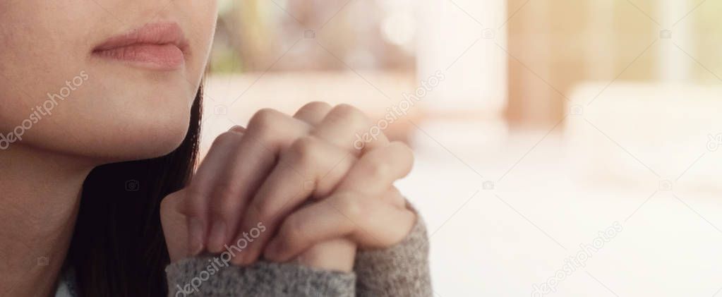 Young asian woman praying