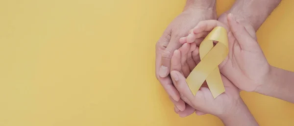 Adult Child Hands Holding Yellow Gold Ribbon Sarcoma Awareness Bone — Stock Photo, Image