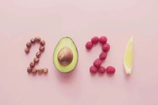 2021 made from healthy food on pink background, Happy New year concept