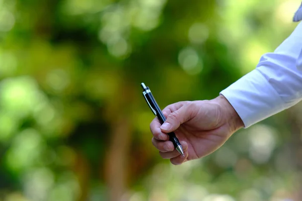 Businessman Holding Pen Space Text — Stock Photo, Image