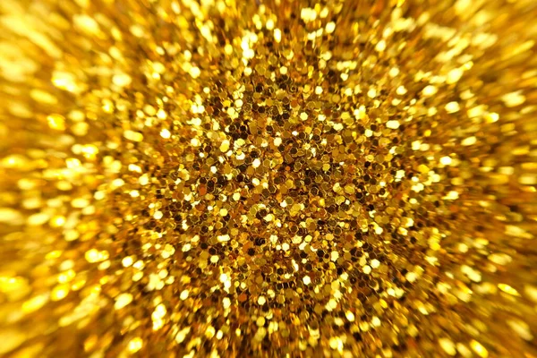 Abstract gold background. Glitter vintage lights background with lights defocused. Christmas and New Year feast bokeh background