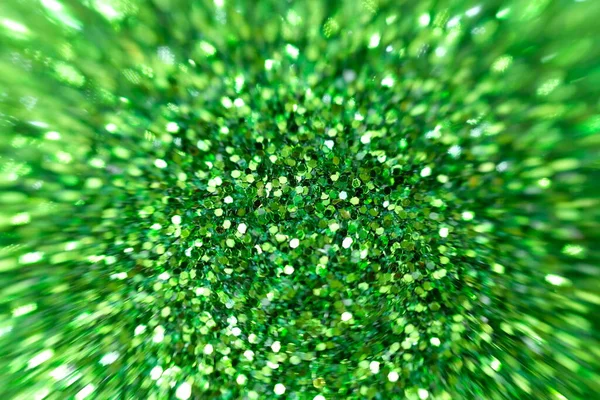 Green glitter surface with green light bokeh and Blurred abstract holiday background