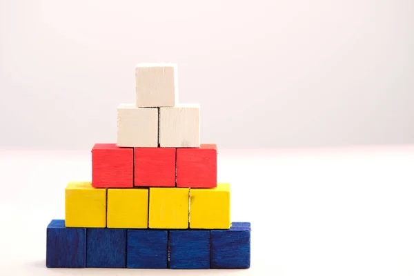 wood cube stacking as step stair. Business concept growth success process and business word on table background and teamwork concept