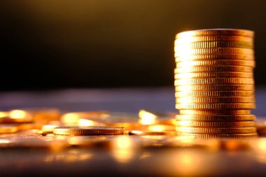 stack of coins on a blurred background 