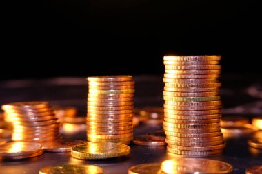 stack of coins on a blurred background 