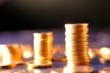 stack of coins on a blurred background 