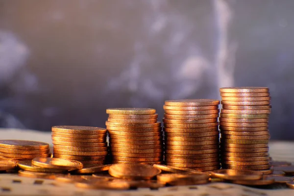 Coins stacked background and advertising coins of finance and banking, increasing columns of gold coins on table,financial success