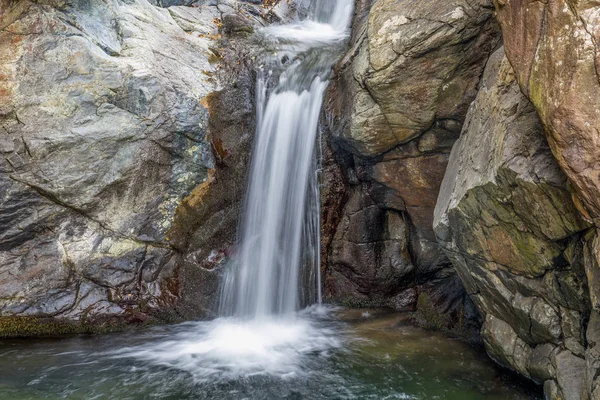 solated waterfall in the forest with the river of water emerald green/waterfall/forest/river/green