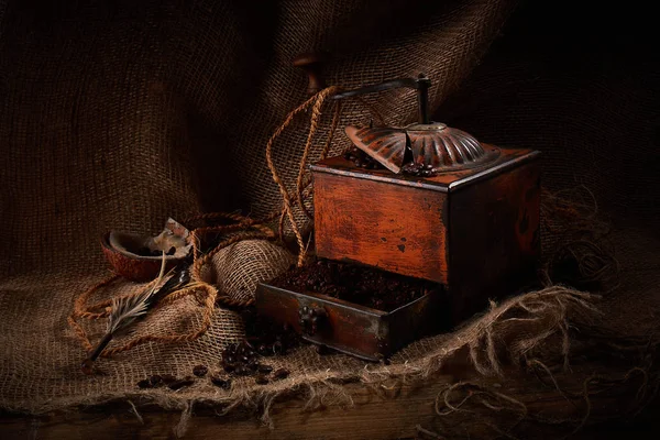 coffee ground and in grains. Old coffee grinder.