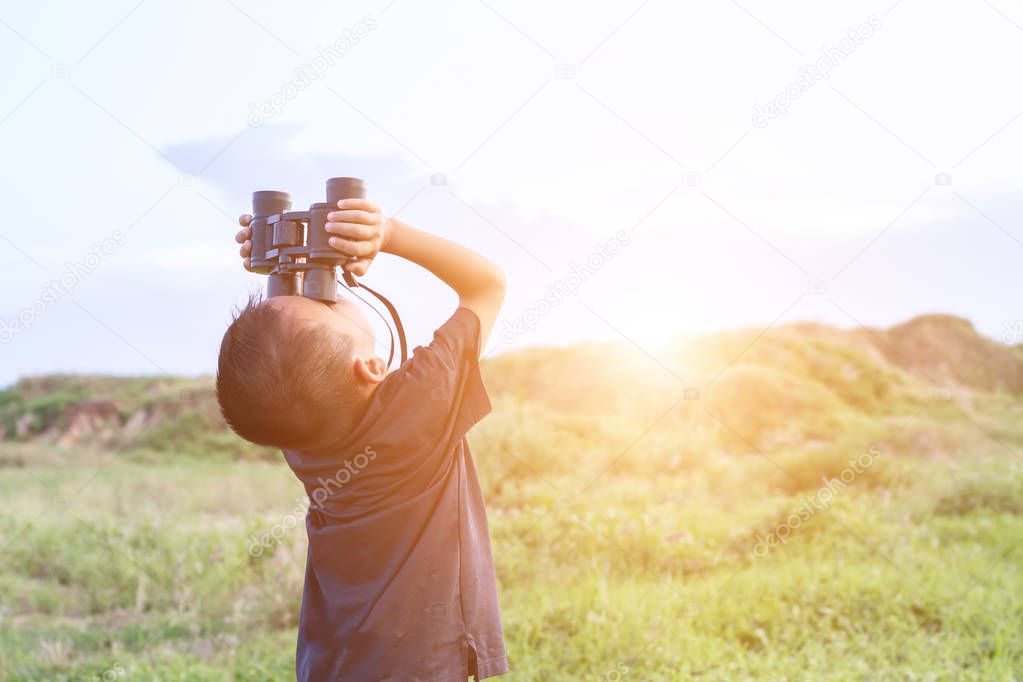 Happy kid playing outdoors. Travel and adventure concept