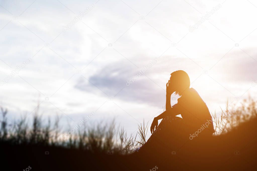 Sad and depressed woman sitting alone