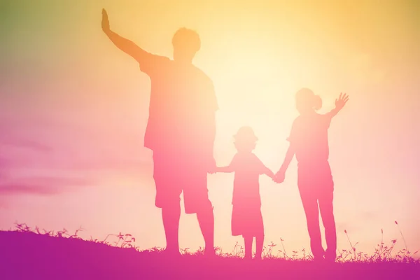 silhouette of a happy family and happy time sunset