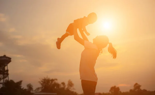 Silhouettes Mother Little Daughter Walking Sunset — Stock Photo, Image