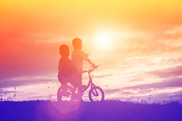 Two Little Boys Bike Silhouette — Stock Photo, Image