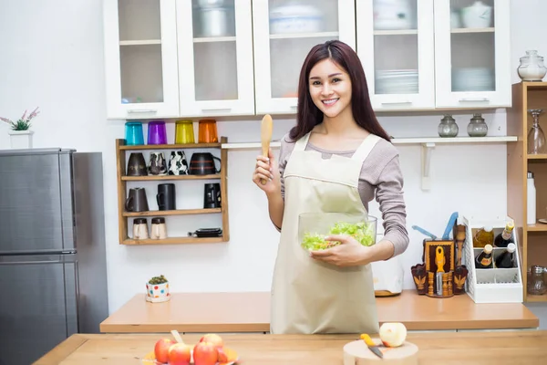 Woman cook at the kitchen, soft focus background