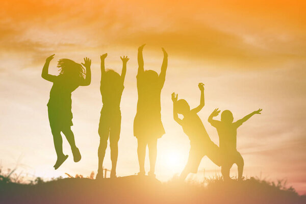 silhouette of a happy children and happy time sunset