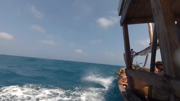 Wooden boat sailing fast through ocean waves — Stock Video