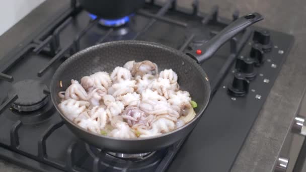 Baby octopus and vegetables cooking in frying pan — Stock Video