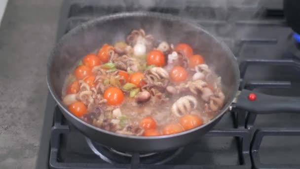 Stir fried baby octopus and vegetables in hot pan — Stock Video