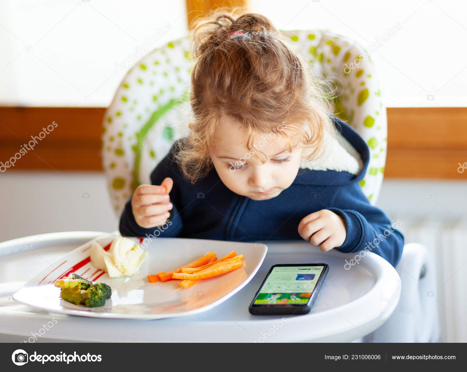 Toddler Eats High Chair While Watching Movies Mobile Phone