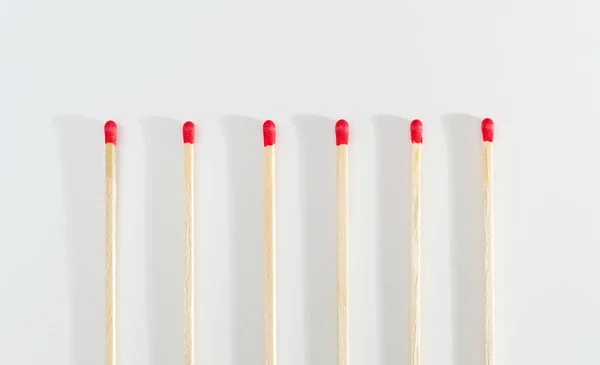 Many matches sticks for lighting a fire on white background.