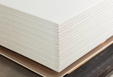 Stacking of white gypsum panels clipart