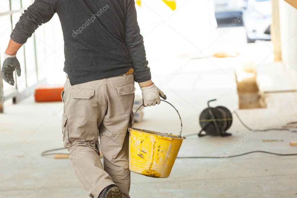 Construction worker with cement.