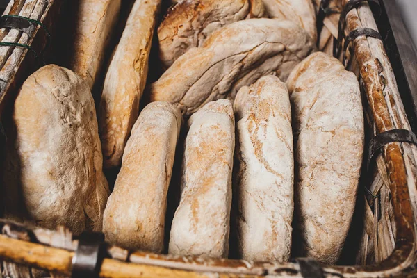 Basket of baked bread with wood oven — Stock Photo, Image