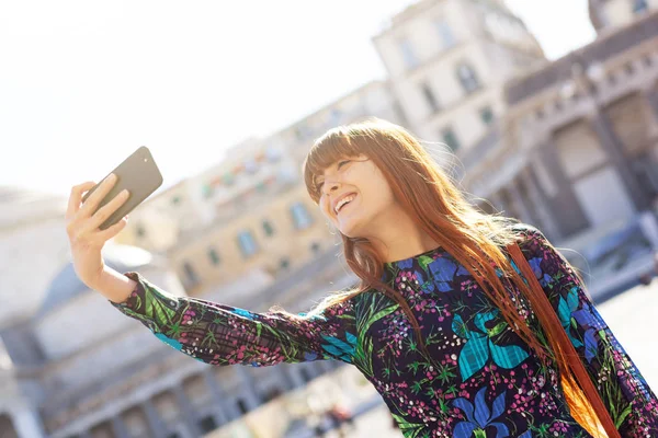 Beautiful young woman takes a selfie in Naples. — Stock Photo, Image