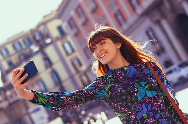 Beautiful young woman takes a selfie in Naples. — Stock Photo, Image