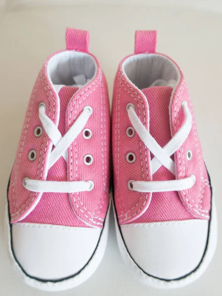 Pink baby Converse All Star sneakers. Stock Photo