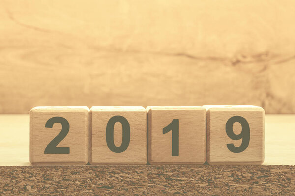 2019 new year concept design with wooden cubes and background. Banner with copy space for text.