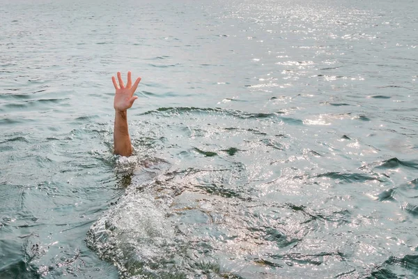 Drowning man, asking for help. Sticking hand out of water. — Stock Photo, Image