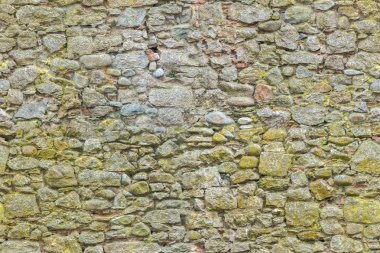 Eski veya eski sarı tuğlalar ve taş duvarlar. Kusursuz tuğla arkaplan