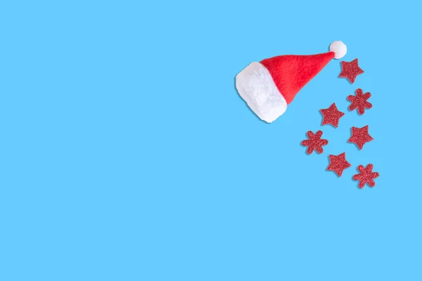 Santa Claus Hat Red Stars Snowflakes Isolated Blue Background Small — Stock Photo, Image