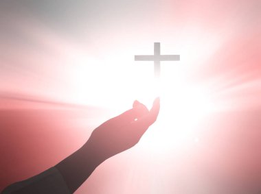 Hristiyan dualarının silueti İsa 'ya dua ederken el kaldırıyor.