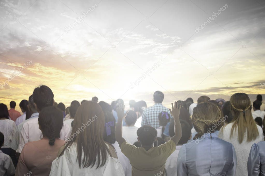 World environment day concept: Silhouette of man raised hands at meadow sunset background