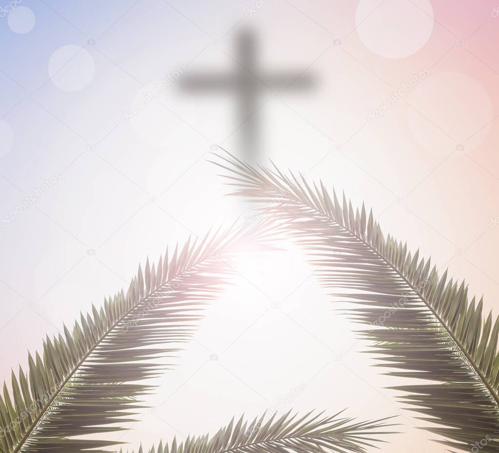 Christian cross appears bright in the sky background