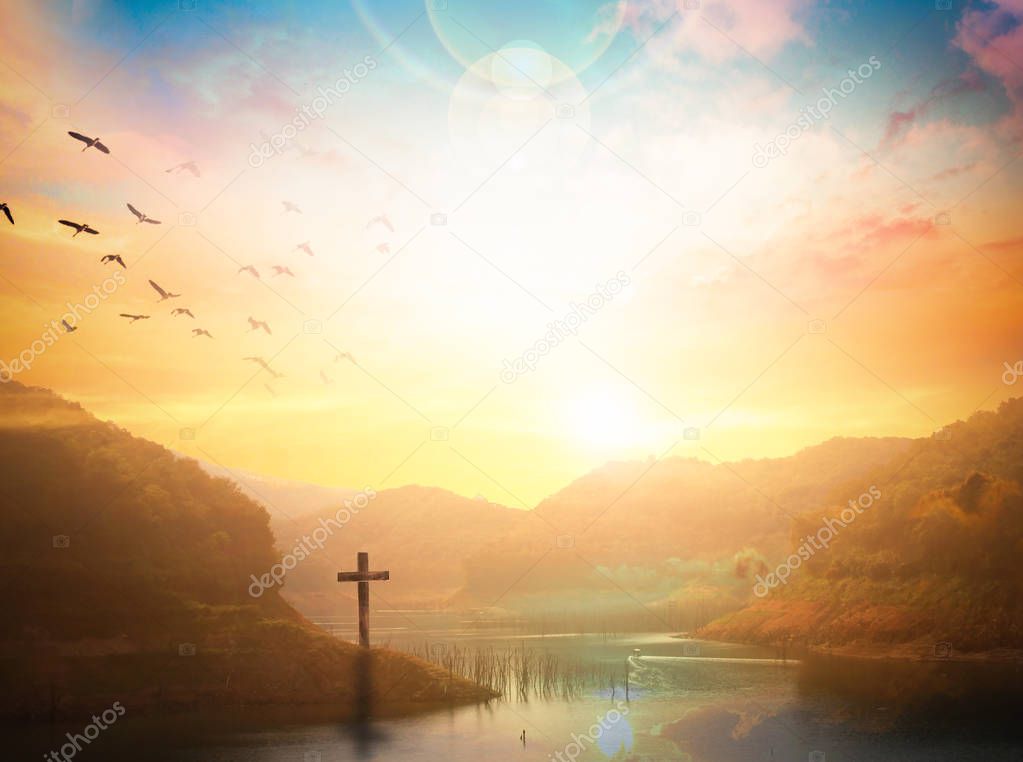 Easter concept:Silhouette cross on Calvary mountain sunset background. 