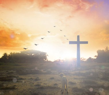 Easter concept:Silhouette cross on Calvary mountain sunset background.  clipart