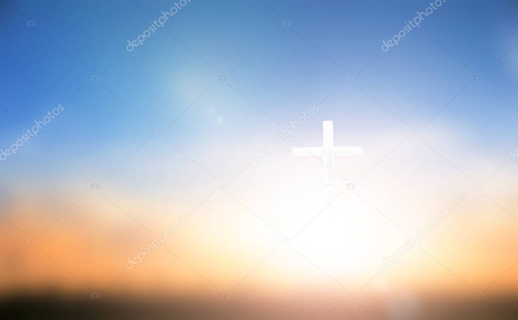 Cross on blurred sky background