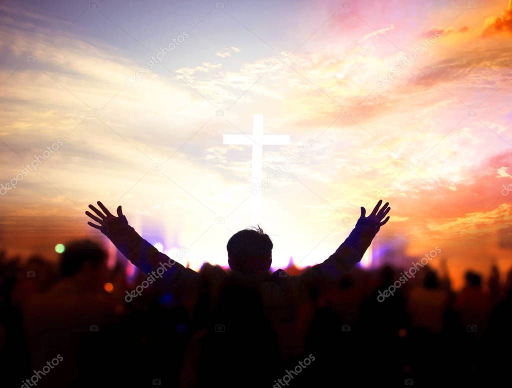 Church worship concept:Christians raising their hands in praise and worship at a night music concert