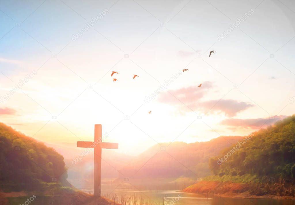 Easter concept: Silhouette cross on Calvary mountain sunset background