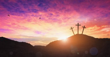 Christmas concept: Crucifixion Of Jesus Christ Cross At Sunset clipart