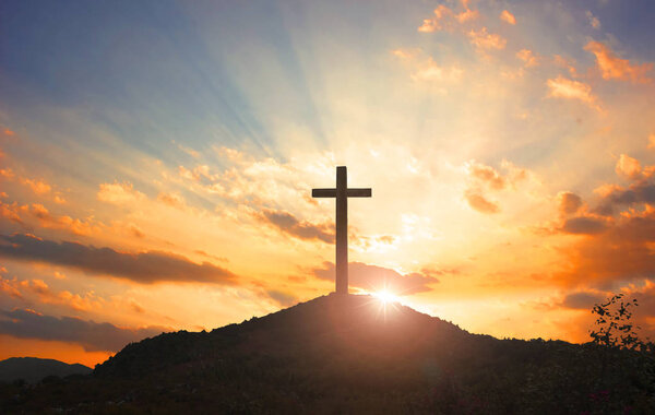 Christmas concept: Crucifixion Of Jesus Christ Cross At Sunset