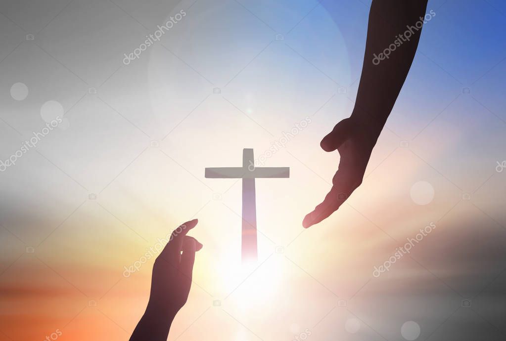 Jesus helping hand conceptWorld Peace Day Help hand on sunset background